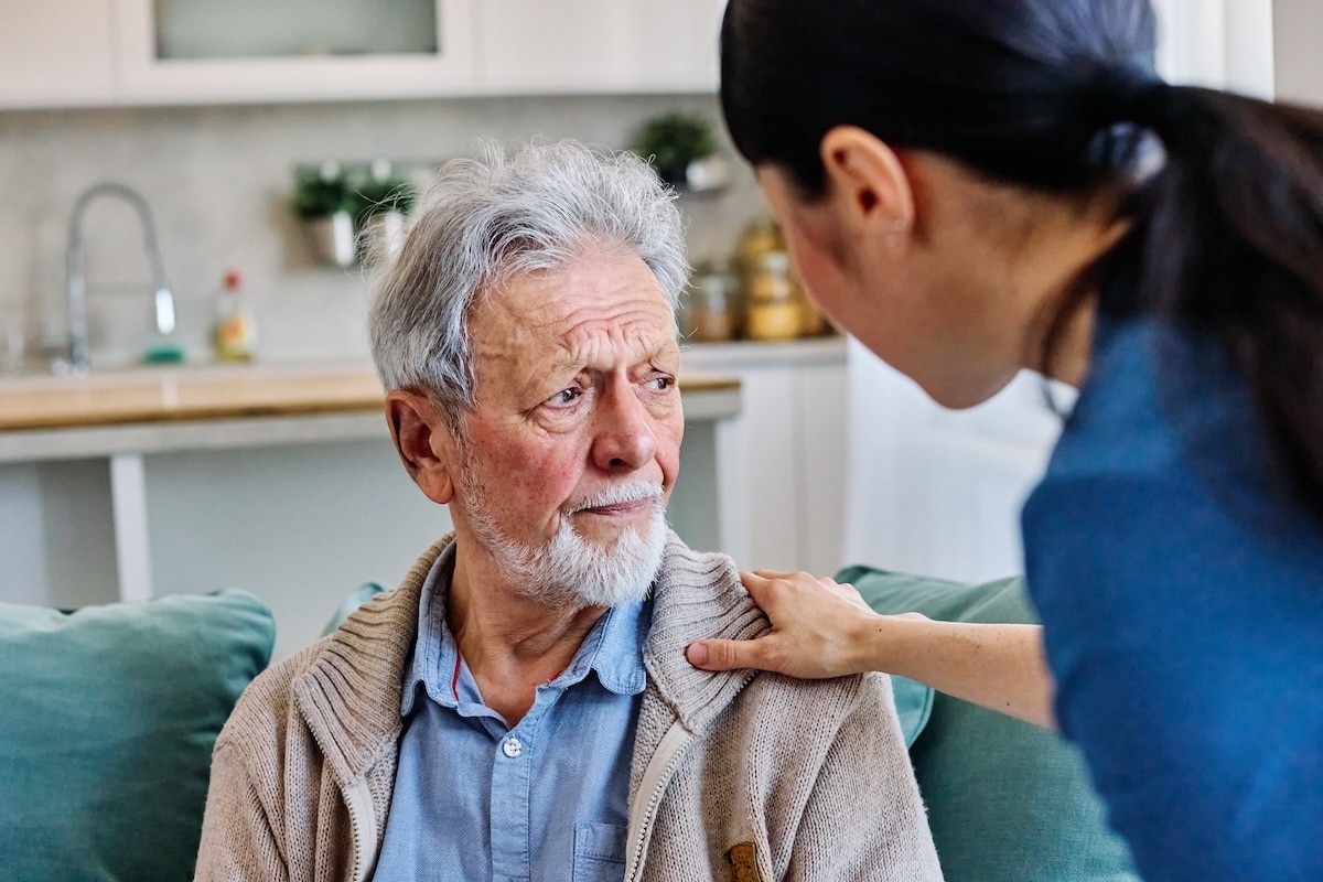 Elderly man receiving care in a nursing home